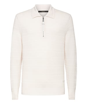 Geweven polo van zuiver merinoswol met lange mouwen. Kraag met rits. Een leren patch met logo is linksonder genaaid. Ribgebreide zomen.