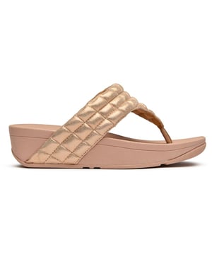 Shimmer your way through summer in these luxuriously padded flip flops that prove comfort and glamour can coexist beautifully. The soft pink synthetic upper cradles your feet while the innovative micro wobbleboard sole works to tone and engage your muscles with every step. At 4cm, these elevated sandals add just the right amount of lift without sacrificing the legendary Fitflop comfort that keeps you walking in blissful ease all day long.