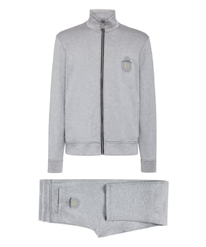 Añada un toque de estilo a su outfit de entrenamiento con este chándal de mezcla de cachemira con el bordado del icónico escudo y bandas laterales a rayas tejidas en jacquard. La chaqueta de chándal con cremallera presenta dos bolsillos con abertura. El pantalón tiene un cordón de ajuste, dos bolsillos en la parte delantera y uno abierto en la parte trasera. Dobladillos de punto de canalé.