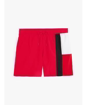 These swim shorts are cut to a streamlined slim fit with a drawstring waist and bold flag design.

Highlights

• Nylon swim fabric
• Tommy Hilfiger flag on side
• Elasticated drawstring waist
• Two waist angled welt pockets
• One back welt pocket
• Signature loop on back pocket
• Tommy Hilfiger branding