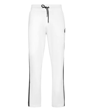 Eleva tu colección de ropa de estar por casa con estos lujosos pantalones de chándal, diseñados para ofrecer una comodidad refinada y un estilo contemporáneo. Confeccionados en algodón de primera calidad, aportan un toque sofisticado al estilo casual.    Confección en lujoso algodón que garantiza un tacto suave y transpirable.   Silueta entallada para un ajuste moderno y elegante.   Cintura elástica con cordón para una comodidad personalizada.   Los puños acanalados añaden un toque refinado a la silueta atlética.   Perfectos para combinar con una sudadera con capucha a juego o una camiseta informal.