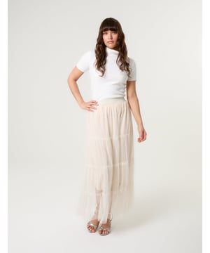 Elevate your wardrobe and feel fabulous in this statement layering tulle skirt. With its elasticated waistband for a comfortable fit, team this skirt with a basic oversized tee and pumps, for a chic kinda look.     