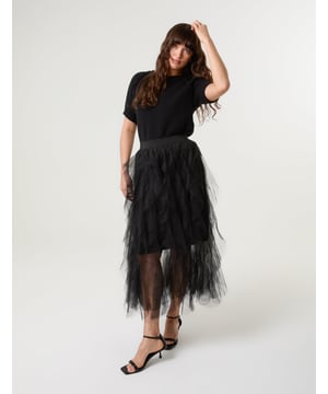 This pretty tulle skirt is an absolute outfit game-changer. Incredibly and surprisingly versatile. Team with a basic oversized tee, PU jacket and chunky boots.     