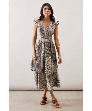 Elegant tiered design with flowing midi-length silhouette
        Feminine ruffle sleeves adding a touch of sophistication
        Flattering V-neckline that frames the dcolletage beautifully
        Striking animal print pattern throughout for a bold statement
        Practical side pockets discreetly integrated into the design
    
    Make a captivating entrance at your next special occasion in this stunning animal print dress from Wallis. The graceful tiered design creates movement and dimension, whilst the ruffle sleeves add a delicate feminine touch. Style with strappy heeled sandals and gold-toned jewellery as seen on our model for a sophisticated ensemble perfect for weddings or formal gatherings. For cooler evenings, layer with a tailored blazer or an elegant pashmina. The versatile midi length works beautifully for daytime events like garden parties or the races when paired with a fascinator and clutch bag. This dress transitions effortlessly from day to evening, ensuring you look glamorous whilst feeling comfortable throughout any special occasion.