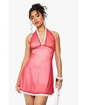 Flirty polka dot mesh fabric with delicate lace trim detailing
        Flattering A-line silhouette that skims the body beautifully
        Plunge halterneck design with open back for a striking look
        Mini length perfect for showcasing your legs
        Feminine scalloped lace hem adds a playful finishing touch
    
    This charming mini dress from Boohoo combines playful polka dots with romantic lace trim for a look that's both sweet and sassy. The halterneck plunge design creates a flattering neckline whilst the open back adds a touch of allure. The A-line silhouette flows gracefully from the empire waistline, creating movement with every step. Style with chunky trainers and a small shoulder bag for daytime outings as seen on our model, or dress it up with strappy heels and statement jewellery for evening drinks with the girls. Perfect for garden parties, brunches or casual family gatherings, this versatile piece can be layered with a denim jacket when the temperature drops. The mesh fabric offers a lightweight feel that's ideal for warmer days whilst maintaining a fashionable silhouette year-round.