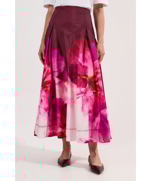 This Karen Millen taffeta maxi skirt makes a captivating statement with its bold floral placement print. The structured waistband creates a flattering silhouette while the voluminous shape offers graceful movement with every step. The maxi length works for garden parties when matched with a cropped denim jacket and strappy sandals. This versatile piece transitions effortlessly from casual weekend brunches to more polished daytime events with just a change of accessories.  Placed floral print on luxurious taffeta fabric Flattering high-waisted design Full maxi length Pleating detail at the waist