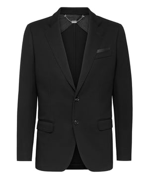 Chaqueta de punto de mezcla de lana con dos botones. Una etiqueta de cuero con el nombre de la marca está cosida en el lado izquierdo del pecho. Dos bolsillos con solapa. Botones de cuerno de búfalo. Ventilación simple. Medio forrado.