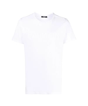 Elevate your wardrobe with the Balmain Paris Embossed Logo White T-Shirt, crafted from 100% premium cotton for exceptional comfort and breathability. Made in Portugal, this sleek white tee features a subtle yet striking embossed Balmain Paris logo, adding a touch of luxury to your everyday style. Its high-quality fabric ensures durability while maintaining a soft feel against the skin. Perfect for pairing with jeans or layering under jackets, this versatile t-shirt combines timeless design with modern sophistication, making it an essential piece for any fashion-conscious man. Experience effortless elegance with Balmain