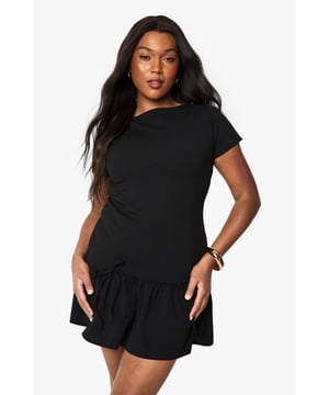Crafted from scuba crepe fabric for a structured yet comfortable fit
        Featuring a playful ruffle hem that adds movement and dimension
        Short sleeve design with a classic round neckline for versatile styling
        Mini length silhouette that flatters the figure while offering ease of movement
        Designed with a relaxed drop-waist shape that creates a carefree, contemporary look
    
    This charming minidress showcases a delightful ruffle hem that brings a touch of femininity to your casual wardrobe. The scuba crepe fabric provides just the right amount of structure whilst maintaining comfort throughout the day. Style with minimal jewellery and flat sandals as shown for daytime gatherings, or transform your look with statement gold accessories and strappy flats for evening drinks with friends. The versatile design works brilliantly for family brunches, weekend shopping trips or casual garden parties. Layer with a denim jacket and trainers for a more relaxed approach, or add a crossbody bag as styled for hands-free convenience. This Boohoo dress embodies effortless style that transitions seamlessly from day to night whilst maintaining that perfect balance of comfort and fashion-forward design.