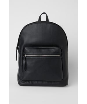 Textured grain faux leather finish for a sophisticated appearance
        Front zip pocket for easy access to essentials
        Spacious main compartment ideal for daily commuting needs
        Padded adjustable shoulder straps for comfortable carrying
        Classic silhouette with clean lines for versatile styling
    
    This commuter backpack combines practicality with understated style, perfect for the modern man on the move. The sleek design transitions effortlessly from morning commutes to weekend adventures, with ample space for your laptop, documents and daily essentials. Pair with tailored trousers and a crisp shirt for office days, or team with dark denim jeans and a casual jacket for pub meet-ups with mates. The durable construction makes it an ideal companion for sporting events or weekend trips away. The minimalist aesthetic ensures this backpack will complement your existing wardrobe without overwhelming your look. A practical yet stylish solution for the man who values both function and classic design in his everyday accessories.