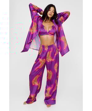 Wild thing. Our satin leopard pajamas are super luxurious, and will have you feeling refreshed come weekend lie-ins. Satin Leopard 3pc Shirt Bralette & Pants PJ Set PJ Shirt, Bralette, & Pants Set Satin Pajamas 3pc Set Long Sleeved Pajama Shirt Button Fastening Oversized Pajama Shirt Satin Bralette Satin Pajama Pants Comfortable High Waist Wide Leg Design Model wears a size M (US size 6/UK size 10).