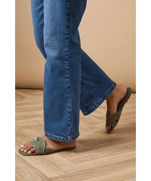 Luxurious suede leather construction
Elegant twist detail on the upper
Comfortable flat heel (0-2cm)
Versatile slip-on mule design
Open-toe silhouette for a breezy feel

Step into effortless chic with the Fleeta Suede Twist Flat Mules from Oasis. These sophisticated sandals blend comfort and style, making them a versatile addition to your wardrobe. The twisted suede upper adds a touch of intrigue, while the flat heel ensures all-day wearability. Perfect for casual outings, pair these mules with cropped jeans and a crisp white shirt for a polished daytime look. Alternatively, style them with a flowing maxi dress for a relaxed garden party ensemble. The neutral hue allows for endless styling possibilities, complementing both bold prints and understated solids. Whether you're running errands or meeting friends for brunch, these mules offer a refined finish to any outfit, embodying the feminine and pretty aesthetic that Oasis is known for.
** Please Note: Natural leather is a unique material that may exhibit slight variations in colour and texture. Due to the inherent characteristics of natural leather and the absence of synthetic coatings, some degree of colour transfer or fading may occur.
