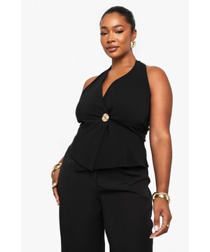 Striking halterneck design with elegant wrap front detail
        Sophisticated gold-tone button accent at the waist
        Sleeveless silhouette with open back for a daring look
        Flattering wrap style that accentuates your curves
        Versatile piece that can be dressed up or down for various occasions
    
    Make a statement on your next night out with this chic halterneck wrap waistcoat. The sophisticated design features a flattering wrap front secured with a standout gold-tone button that adds just the right amount of glamour. Perfect for the confident Boohoo woman who loves to showcase her style, this piece pairs beautifully with wide-leg trousers as shown for a coordinated ensemble that commands attention. Style with statement jewellery and strappy heels for drinks with the girls, or layer over a fitted bodysuit with jeans for a more casual take on nightlife dressing. The open back design offers a sultry touch that's ideal for warm evenings in the city. This versatile top transitions effortlessly from early evening cocktails to late-night dancing, ensuring you remain the centre of attention wherever the night takes you.