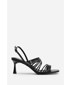 Introduce a touch of glamour to your footwear collection with our Callie Square Toe Low Block Slingback Heel with Multi Strap Detail. These heels are the epitome of elegance and sophistication, making them the perfect finishing touch to any outfit, whether it's for a formal event, a night out, or a special occasion. Key Features: • Exquisite Design: The square toe silhouette of these low block slingback heels exudes a timeless appeal that never goes out of style. Enhanced by multi strap details, these shoes are guaranteed to make heads turn. • Multi Strap Details: The multi strap details doesn't just lend a chic and trendy vibe, but also offers secure and comfortable fastening. Adjust the slingback for a custom fit, ensuring these heels stay firmly in place. • High-Quality Construction: Crafted from premium materials, these high heels are designed to last. The high-quality construction ensures long-lasting durability while maintaining the comfort of your feet. • Versatile Addition: Make an entrance at any event. Be it a lavish wedding, a formal workplace event, or a casual outing with friends. The classy square-toe design with multi strap details is versatile enough to pair with a variety of outfits and are your perfect partner for a chic update to your look. Specifications: • Material: Faux Leather • Heel Height: 3.3' (8.3cm) approx Invest in our Callie Square Toe Low Block Slingback Heel with Multi Strap Detail and bring that extra touch of elegance and sophistication to your wardrobe. They speak loud and clear of luxury and style – a piece worth showcasing!