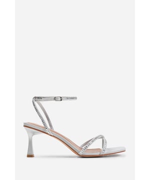 Introduce a touch of glamour to your footwear collection with our Sammi Square Toe Low Block Heel with Diamante Cross Over Strap Detail. These heels are the epitome of elegance and sophistication, making them the perfect finishing touch to any outfit, whether it's for a formal event, a night out, or a special occasion. Key Features: • Exquisite Design: The square toe silhouette of these high heels exudes a timeless appeal that never goes out of style. Enhanced by the diamante detail strap, these shoes are guaranteed to make heads turn. • High-Quality Construction: Crafted from premium materials, these high heels are designed to last. The high-quality construction ensures long-lasting durability while maintaining the comfort of your feet. • Versatile Addition: These are more than just your regular high heels. Make an entrance at any event. Be it a lavish wedding, a formal workplace event, or a casual outing with friends. The classy square-toe design with the decorative diamante detail is versatile enough to pair with a variety of outfits and are your perfect partner for a chic update to your look. Specifications: • Closure: Ankle strap with buckle. • Heel Height: 3.3' (8.3cm) approx Invest in our Sammi Square Toe Low Block Heel with Diamante Cross Over Strap Detail and bring that extra touch of elegance and sophistication to your wardrobe. They speak loud and clear of luxury and style – a piece worth showcasing!