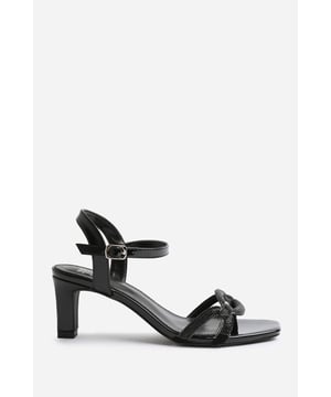 Step out in style and sophistication with our Austen Extra Wide Fit Square Toe Low Block Heel With Diamante Strap Detail. These stunning shoes are designed to elevate your outfit and add a touch of glamour to every step. Key Features: • Cut-Out Strap Design: The Cut-Out Strap detail adds an elegant and polished touch to these shoes, making them the perfect option for those who want to make a fashion statement. • Breathable Design: The open toe front and heel provide breathability, ensuring your feet stay cool and comfortable even on warmer days. • Comfortable Height: The mid-high block heel provides stability and support, while the cushioned insole ensures all-day comfort. Walk confidently knowing that your feet will stay comfortable, no matter where the day takes you. • Versatile Style: These shoes are versatile and can be paired with a variety of outfits. Dress them up with a skirt or dress for a night out on the town or dress them down with jeans for a more casual look. The options are endless. Specifications: • Heel Height: 3' (7.6cm) approx • Strap Detail: Single-strap design adds elegance and polish to these shoes • Peep Toe: Stylish peep toe design adds a fashion-forward element • Closure: Buckle closure for a secure and adjustable fit Elevate your style and make a statement with our Austen Extra Wide Fit Square Toe Low Block Heel With Diamante Strap Detail. These shoes combine fashion and functionality, allowing you to showcase your individuality while enjoying all-day comfort. Step out with confidence and embrace your inner trendsetter.