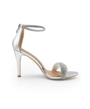 Indulge in glamour and elegance with our Julia High Heel Sandals with Diamante Ankle Strap and Open Toe. These stunning sandals are designed to make a statement and add a touch of sparkle to every step. Key Features: • Dazzling Diamante Accents: The ankle strap is adorned with shimmering diamante embellishments that catch the light and add a touch of glamour to these sandals. • Stylish Design: The open toe design showcases your pedicure and adds a chic and fashionable element to these high heel sandals. • Ankle Strap for a Secure Fit: The ankle strap provides a secure and adjustable fit, ensuring that the sandals stay comfortably in place as you walk or dance the night away. • Comfortable High Heel: The high heel provides an elongated silhouette and adds a touch of sophistication to any outfit, while the cushioned insole ensures all-day comfort. • Versatile Style: These sandals are perfect for both formal and informal occasions. Wear them with a cocktail dress for a special event or dress up your favourite jeans for a night out. • Durable Construction: Crafted with high-quality materials, these sandals are built to last, allowing you to enjoy their elegance for years to come. Specifications: • Heel Height: 3.5' (8.9cm) approx • Material: Faux Leather • Sole: Rubber sole for comfort and traction Elevate your style and add a touch of bling with our Julia High Heel Sandals with Diamante Ankle Strap and Open Toe. Whether you're attending a wedding, party, or a special occasion, these sandals will make you shine with every step. Experience both comfort and glamour, and make a lasting impression with our beautiful high heel sandals.