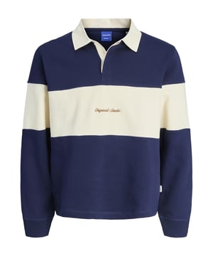 Deze polo combineert stijl met sportieve nonchalance. De normale pasvorm zorgt voor comfortabele bewegingsvrijheid en een coole look tegelijkertijd. De klassieke ronde hals met polokraag en blinde knoopsluiting geeft het shirt een cleane look. De smalle mouwuitsnijdingen en verlaagde schouders geven je een modern silhouet. Alles sluit perfect aan dankzij de omgeslagen zoom. Het colour blocking design maakt van dit poloshirt een echte blikvanger. Het subtiele borduursel op de voorkant rondt de look in stijl af. Het materiaal voelt aangenaam aan op de huid en is de hele dag comfortabel om te dragen. Voor school, vrije tijd of familiebezoek - dit shirt is altijd perfect. Een echte favoriet voor je garderobe.