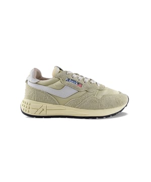 Reelwind lage sneakers Autry van nylon en wit en zwart leer.Logopatch aan de buitenkant. Zwarte leren contrefort met geel logo.Tong met logopatch.Rubberen zool met vergeeld effect en zwarte details. Witte vetersluiting.