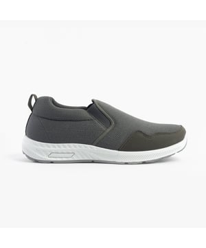 These wide-fit men's trainers feature a textile upper and lining with a rubber sole, offering breathable comfort. Ideal for casual wear with a low-top design and slip-on closure