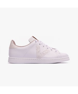 These casual women's trainers feature a leather and glitter swirl design with a textile lining, PVC sole, and low heel, offering comfort for everyday wear