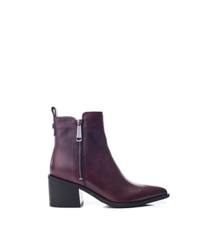 Perfect your look in Perth, the classic ankle boot combining simplicity and sophistication. This style features a pointed toe design with a zip fastening for effortless foot entry and a block heel for added height.