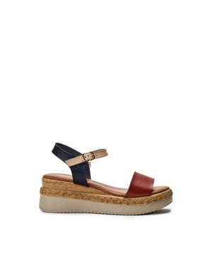Keep your feet cool this season with Nyx, a low wedge heeled sandal that offers the perfect blend of classic sandals style and cool comfort. Complete with metallic buckle detailing and an easy to wear wedge, this style embodies both fashion and practicality.