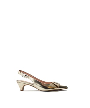 Navigate the season in Nutmeg, the slingback, kitten-heel sandal. This style features a chic pointed toe with a bow embellishment. The low heel provides wearable height, whilst the leather lining ensures all-day comfort.