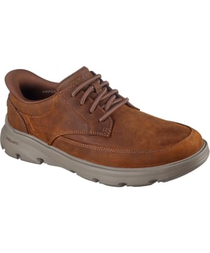 Gehen Sie nahtlos von Ihrem Schreibtisch zum Abendessen in den Skechers Arch Fit Garza - Rowan. Dieses business-casual Design, ausgestattet mit unserem exklusiven Heel Pillow, verfügt über ein Obermaterial aus Leder und Synthetik, feste Stretch-Schnürsenkel und eine luftgekühlte Arch Fit Einlegesohle.