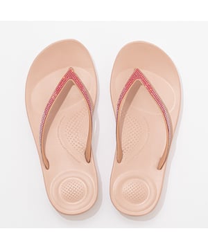 These slip-on flip-flops feature a rubber upper and EVA lining and sole, offering lightweight comfort. Ideal for casual wear with a flat heel and easy slip-on design