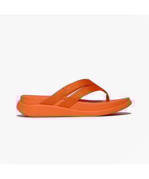 These flip-flops feature a polyester upper and lining with a rubber sole, offering comfort and microwobbleboard support for casual wear