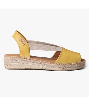 Leather espadrille sandals with a wedge heel, breathable lining, and slip-on design. Ideal for casual wear, featuring a low heel and rubber sole for comfort