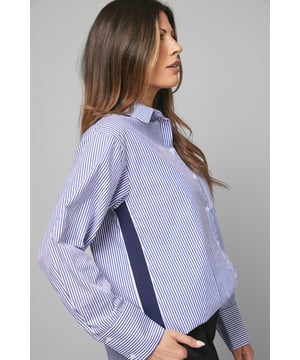 Classic collared shirt with distinctive vertical stripe pattern
        Stylish side tape detail adds contemporary flair
        Practical front pocket for subtle functionality
        Relaxed fit with elegant button-down front
        Versatile curved hem perfect for both tucked and untucked styling
    
    This Wallis stripe shirt combines timeless sophistication with modern detailing. The crisp cotton fabric ensures breathable comfort throughout the day, whilst the distinctive side tape and pocket detail create visual interest that sets it apart from ordinary shirts. Style it tucked into tailored trousers as seen on our model for a polished daytime look, or wear it untucked with your favourite jeans and trainers for casual weekend brunches. The versatile design makes it ideal for family gatherings or informal work settings. For cooler days, layer under a lightweight cardigan or casual blazer. Complete your ensemble with minimal jewellery and comfortable flats for an effortlessly chic appearance that reflects the Wallis woman's desire for both comfort and glamour in her everyday wardrobe.