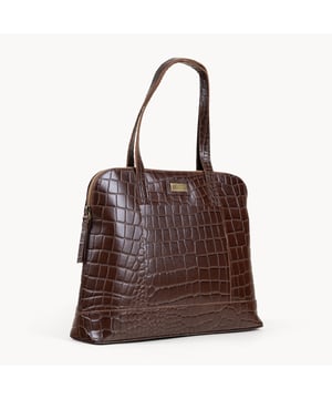 The designer 'Eva' tote bag in black real croc leather is a beautiful timeless design chosen for its lightweight characteristic. Unlined and spacious interiors ensure that you don't run out of space whether you're commuting. Add a touch of sophistication to all your outfits with the 'Eva' tote bag, a must have addition to your collection of handbags. Zip top opens to a roomy interior providing extra security to your belongings. Comes unlined with an exposed, soft to the touch natural leather interior. Extremely lightweight and leather handle for a comfortable carry on your shoulder. Slip pockets on either side to slide in your essentials. Adorned with the inimitable Assots London brushed gold metal logo for that designer look. Fittings Colour: Antique Brass. Composition: Body: 100% Genuine Leather. Lining: Unlined. DISCLAIMER : All pictures shown are for illustration purpose only. Actual product colour may vary due to different ambience lighting or the screen display settings.