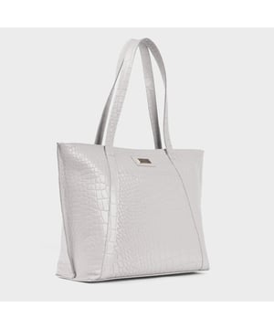 The ‘Agnes’ work tote bag is beautifully handcrafted with premium Croc embossed genuine leather for that designer look. It features slip-in pockets both in the front and rear of the bag to slide in your daily essentials. This Croc Leather shopper is designed to ensure you don’t run out of space and have ample room for all your necessities when you’re out and about. Walk in style with ‘Agnes’, the perfect travel companion ideal for all occasions. Secured zip top closure opens to a spacious interior. Slip pockets in the front and back of the bag. Fits a 13-inch laptop. Double Stitching on the handles for extra reinforcement. Reinforced base to avoid bulging when stuffed. Unlined shopper to maintain the natural leather look of the bag. Leather shoulder handle for easy pick up and go. Adorned with an Assots London brushed gold clean finish logo demonstrating it’s premium quality. Fittings colour: Antique Brass Composition: Body: 100% Genuine Leather. Lining: Natural Cotton Lining. DISCLAIMER: All pictures shown are for illustration purpose only. Actual product colour may vary due to different ambience lighting or the screen display settings.