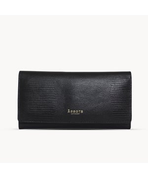 The ‘Claire’ flapover ladies purse is handcrafted with the premium lizard textured leather to give that designer look. Equipped with RFID technology, this practical ladies purse features a magnetic fastening closure with plenty of room to organise your cash, cards and coins. This large leather ladies purse is perfect to compliment your handbag and fits in easily. Stay safe and organised with ‘Claire’ the perfect addition to your collection of purses ideal for all outfits and occasions. Secured flap over magnetic fastening closure to store your essentials safely and securely. Foldover flap design. Equipped with RFID technology for safety. Additional back zip pocket to ensure you don’t run out of space. Two note compartments. Eight internal card compartments. Two windowed ID slots. Assots branded lined interiors. Lightweight for easy carry. Fittings Colour: Clean Brass. Composition: Body: 100% Genuine Leather. Lining: 100% Cotton. DISCLAIMER : All pictures shown are for illustration purpose only. Actual product colour may vary due to different ambience lighting or the screen display settings.