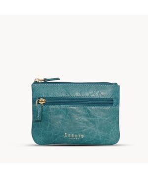 Keep things simple with this small coin purse crafted from super soft and supple natural grain Nappa leather. Featuring a simple compartment that opens along the top, the 'Mary' has a fully lined matching interior that is ideal for the basics. Comes in four more bright colours to spot easily in your bag. Zip top closure. Zip pocket at the front. Embellished with gold metal zippers and an inimitable Assots London golden foil embossed logo. Fittings: Gold Composition: Body: 100% Genuine Leather. Lining: 100% Polyester. DISCLAIMER : All pictures shown are for illustration purpose only. Actual product colour may vary due to different ambience lighting or the screen display settings.