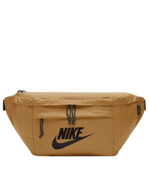 The Nike Brown Crossover Bag combines style and practicality in one compact design. Crafted from durable 100% polyester, this bag features a spacious 10-litre main compartment with a secure zip fastening to keep your essentials safe. A convenient front pocket with zip closure offers quick access to smaller items. The adjustable strap with buckle clip ensures a comfortable fit for all-day wear. Finished with a bold Nike Swoosh logo, this crossover bag is perfect for daily use, whether you're heading to the gym, running errands, or exploring the city. Durable, versatile, and effortlessly stylish