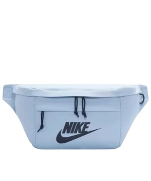The Nike Light Blue Crossover Bag combines style and practicality in one sleek design. Crafted from durable 100% polyester, this bag features a spacious 10-litre main compartment with a secure zip fastening, perfect for keeping your essentials safe on the go. The front zip pocket offers easy access to smaller items, while the large Nike Swoosh logo adds a bold, sporty touch. An adjustable strap with a buckle clip ensures a comfortable, customizable fit for all-day wear. Ideal for daily use, this lightweight crossover bag keeps your belongings organized and within reach wherever you head