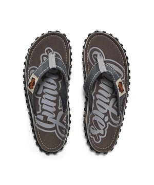 Unisex flip-flops made from recycled cotton canvas and rubber offer lightweight, breathable comfort with a slip-on design, round toe shape, and flat heel for casual wear