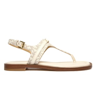 The Michael Kors Mandy Thong sandals combine luxury with everyday wearability. Crafted with a premium leather upper in a versatile natural shade, these sophisticated flip flops offer both style and comfort for warm-weather occasions. The durable rubber sole provides reliable traction while maintaining the elegant aesthetic that Michael Kors is known for. Perfect for beach vacations or casual summer outings, these refined sandals will complement everything from sundresses to linen pants.