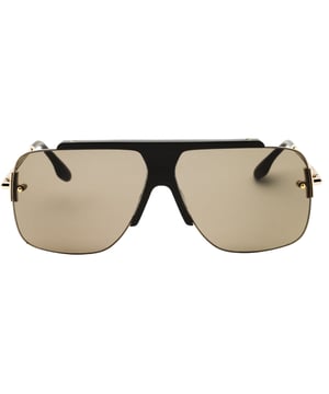 Elevate your style with the Victoria Beckham Mocha Brown Lensed Gold Sunglasses, designed for the modern woman who values both fashion and function. These sunglasses feature a sophisticated mocha and brown color palette complemented by elegant gold accents, creating a timeless look that enhances any outfit. With precise dimensions of 64x12x140mm, they offer a comfortable fit and excellent coverage to protect your eyes from the sun. Crafted with attention to detail, these sunglasses blend luxury and practicality, making them an essential accessory for your wardrobe. Step out confidently and make a statement wherever you go. 100% Metal