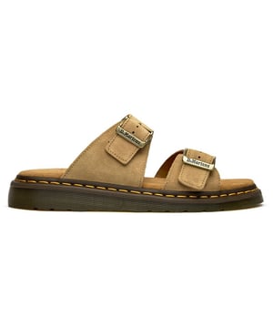 The Dr. Martens Josef brings the brand's legendary durability to warm-weather wear with a refined tan suede construction. Twin buckles offer both security and style, while the signature AirWair sole delivers the comfort and resilience that's made Dr. Martens a timeless choice. Side-stitched detailing and a soft suede insock complete this sophisticated take on casual summer footwear.