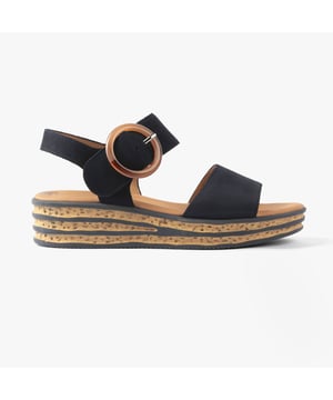 These women's open-toe wedge sandals feature a leather upper, textile lining, and rubber sole for comfort and lightweight wear, perfect for casual occasions