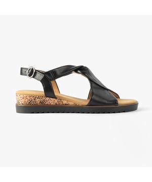 These women's open-toe wedge sandals feature a leather upper, textile lining, and rubber sole for comfort and lightweight wear, ideal for casual occasions