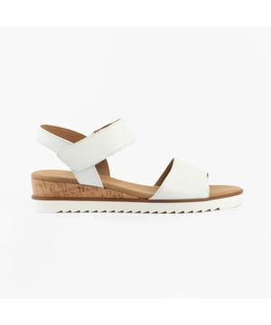 These women's open-toe sandals feature a suede upper, textile lining, rubber sole, and a low wedge heel. Lightweight and wide for comfortable casual wear
