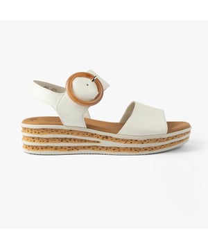 These women's open-toe wedge sandals feature a leather upper, textile lining, and rubber sole for comfort and lightweight wear, ideal for casual occasions