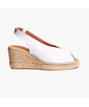 These women's espadrille sandals feature a leather upper and lining with a synthetic sole, a wedge heel, and slip-on design, offering comfort and breathability for casual wear