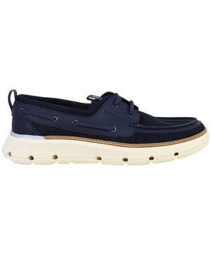 Crafted for life on and off the water, the Cole Haan ZERØGRAND Regatta Women’s Boat Shoes in Navy combine nautical charm with advanced comfort technology. With lightweight flexibility, breathable materials, and classic moc styling, these shoes are ideal for seaside strolls, summer city days, or travel-ready wardrobes.
Key Features
Water-Resistant Mesh &amp; Synthetic Upper

Designed to dry quickly while providing a flexible, breathable fit that adapts to your foot.

Nautical-Inspired Moc Toe Design

Timeless boat shoe silhouette elevated with modern detailing and refined stitching.

ZERØGRAND Cushioned Midsole

Lightweight EVA midsole offers responsive cushioning and shock absorption with every step.

Multi-Directional Rubber Outsole Pods

Engineered for slip-resistance and grip on both wet and dry surfaces—ideal for docks, decks, or city streets.

360° Lacing System

Ensures a snug, secure fit while adding to the authentic boat shoe aesthetic.

Padded Collar and Heel

Increases comfort and support around the ankle area.

From coastal getaways to urban escapes, the Cole Haan ZERØGRAND Regatta Women’s Navy Boat Shoes deliver performance, comfort, and timeless style—reimagined for the modern explorer.