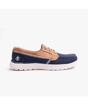 These casual low-top shoes feature a leather and textile upper with a rubber sole, offering comfort and a relaxed fit for everyday wear